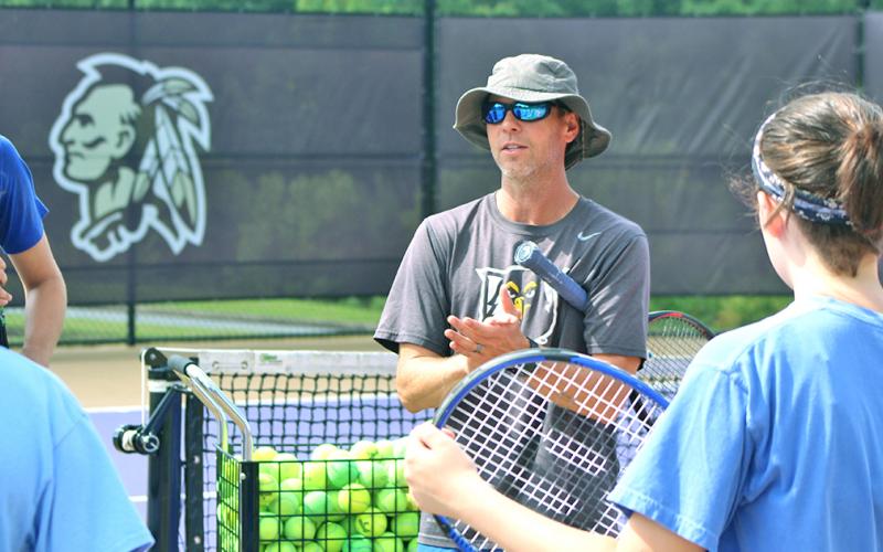 UNG head tennis coach Kent Norsworthy talks to campers at the LCHS Tennis Camp.